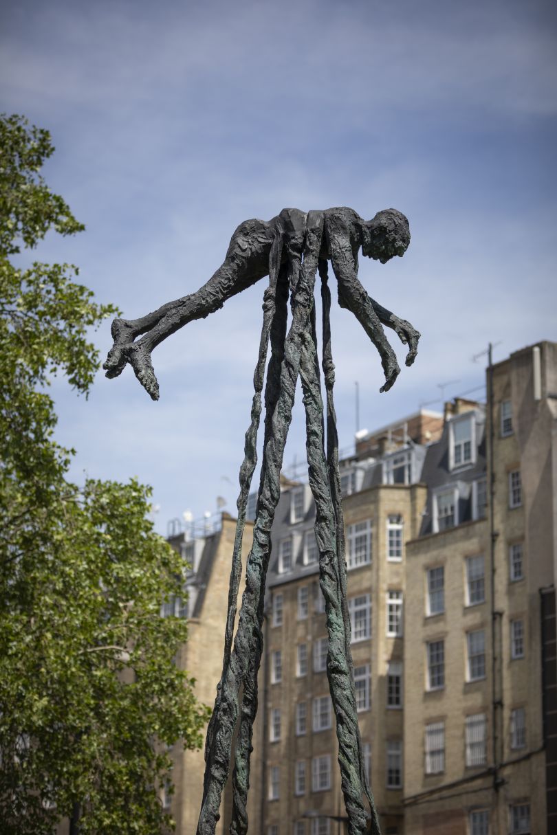 London, UK. 7th June, 2021. Shoppers near Louis Vuitton are out in the sun  around David Breuer-Weil's Alien 2 at the bottom of New Bond Street -  Public art sculptures by contemporary