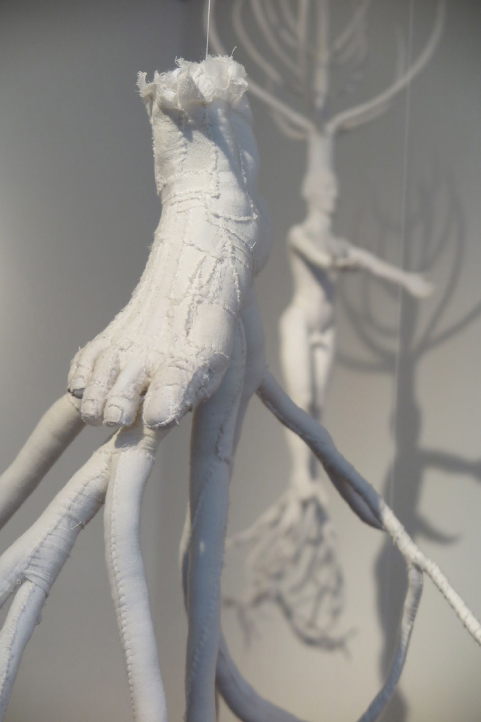 Soft sculptures of the human anatomy crafted out of old bed sheets by