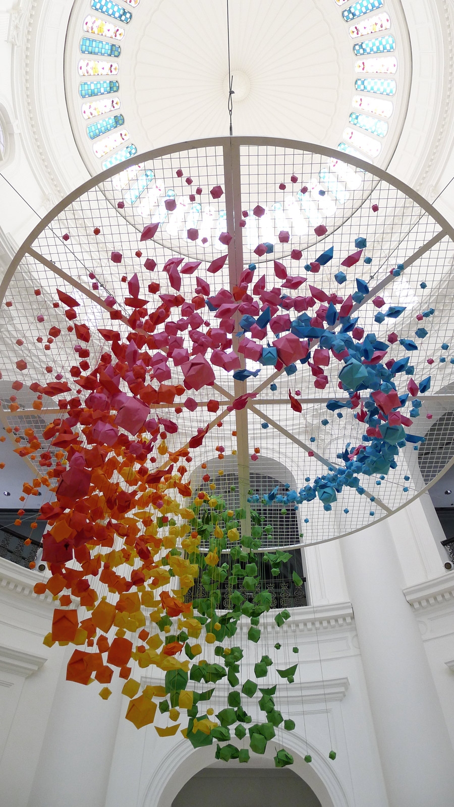 Giant, rainbow hanging installation of 1,000 origami spheres, fish and