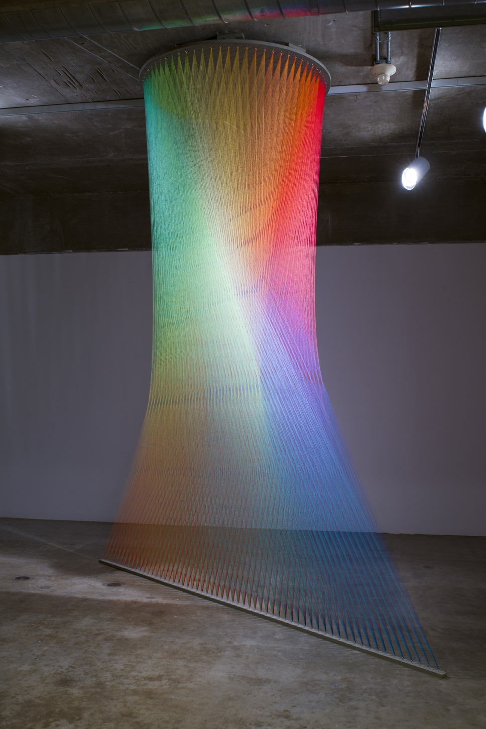 Artist weaves 60 miles of colourful thread to create spectacular indoor